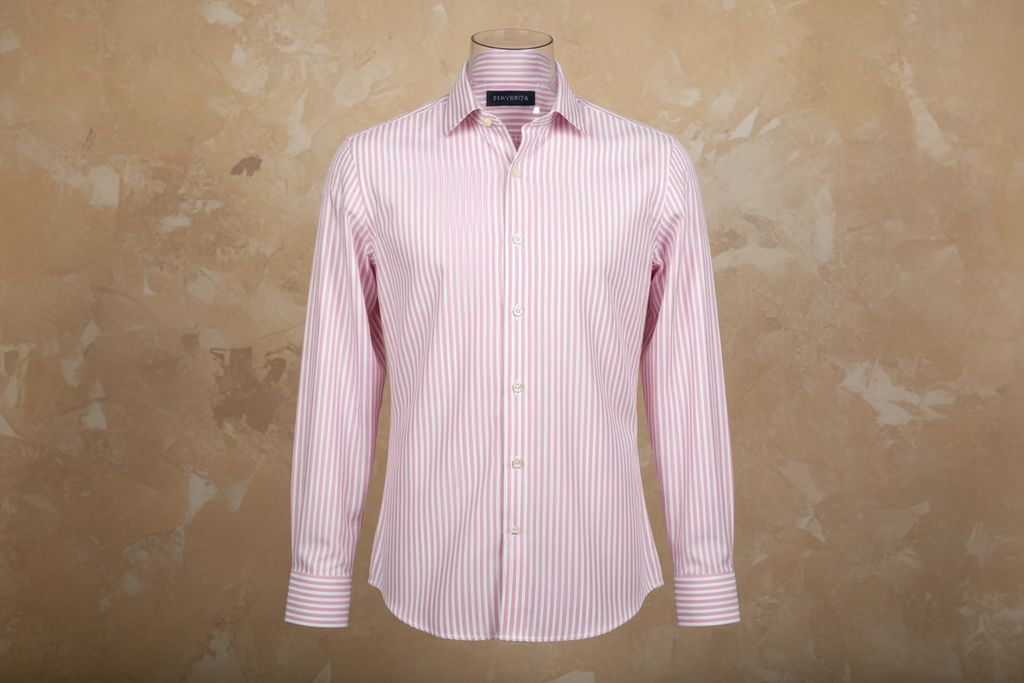it hangs good but strip need to be tween 2-2.5mm as it is with below A premium men’s shirt with light pink × white vertical pinstripes, each 2–2.5 mm wide, shown on a mannequin (hanged presentation).
Smooth poplin fabric, button-down collar, white buttons, no chest logo.
Place a subtle BRAVENTA neck label inside the collar.
Studio lighting, clean background, premium appearance, European Modern Comfort Fit.